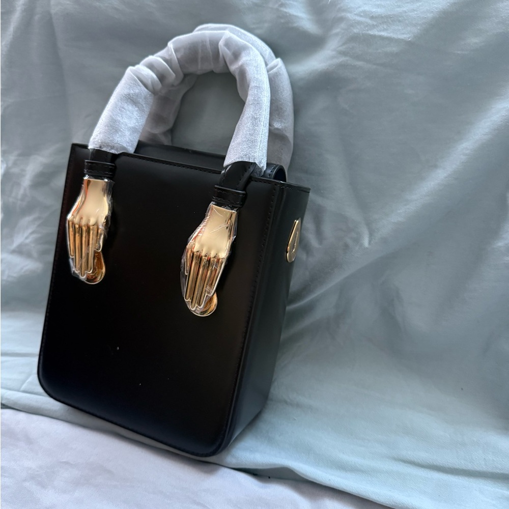 Elegant Black Handbag with Gold Accents